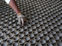 Indian Potter Making Earthen Lamps For The Hindu Festival Celebrations In Ajmer