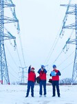 Electric Workers Patrol Power Lines in The Snow.
