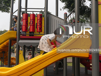 JAKARTA, INDONESIA - MAY 09 : Children playing without wearing a mask at public park in Jakarta, Indonesia, on May 09, 2023. The World Healt...