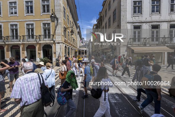 People are seen walking along one of the streets in the neighborhood of Baixa, Lisbon. 02 May 2023.  