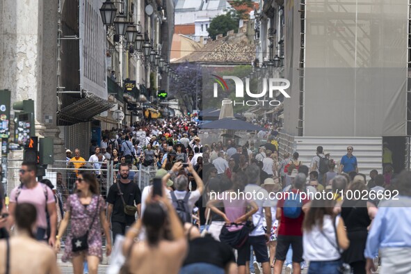 People are seen walking near the Augusta arch in Praca de Comercio, in the Baixa neighborhood, Lisbon. 02 May 2023. 