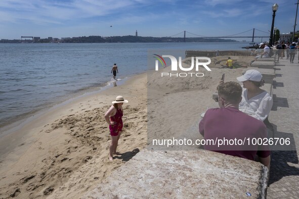 Several people are seen resting near a beach on the Tejo river, in the Baixa neighborhood, Lisbon. 02 May 2023. 