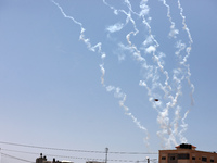 Rockets are fired from the Gaza City toward Israel on May 13, 2023. Israeli air strikes battered Gaza again on May 13 in response to rocket...