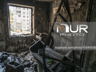 Workers demolish a residential building heavily damaged during Russia's attack in the town of Irpin, outside of Kyiv, Ukraine May 13, 2023 (