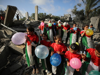 Palestinian children participate in an activity aimed to support the mental health of children affected by the recent Israel-Gaza fighting,...