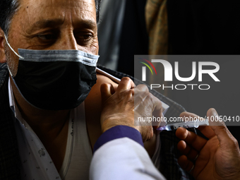 A man recieves a dose of Vaccine during Hajj pilgrimage vaccination program in Sopore District Baramulla Jammu and Kashmir India on 16 May 2...
