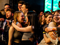 Audience are seen hugging each other during the concert that the Ukrainian band 'GO_A' gave for free for the Ukrainian students at the Breda...