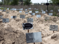 

Most graves of people who died in the Kyiv region as a result of the full-scale Russian invasion of Ukraine are mostly unmarked near the c...