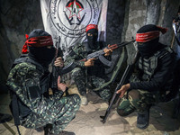 Fighters from the Democratic Front for the Liberation of Palestine (DFLP) walk in a tunnel  in the southern Gaza Strip during preparation an...