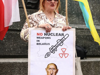 A protester holds a banner during a daily demonstration of solidarity with Ukraine at the Main Square in Krakow, Poland on May 16, 2023. Sin...