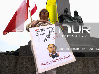 A protester holds a banner during a daily demonstration of solidarity with Ukraine at the Main Square in Krakow, Poland on May 16, 2023. Sin...