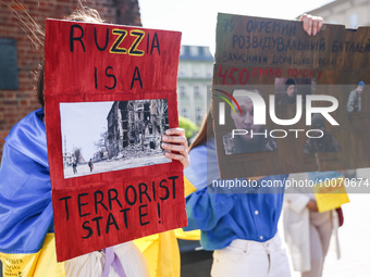 Protesters hold banners during a demonstration of solidarity with Ukrainians in Russian captivity. Krakow, Poland on May 21, 2023. Since the...