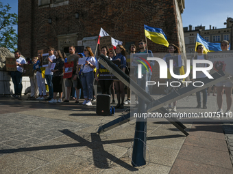 KRAKOW, POLAND - MAY 21, 2023:
Members of the local Ukrainian diaspora gather at the main Market Square in Krakow to commemorate the defende...