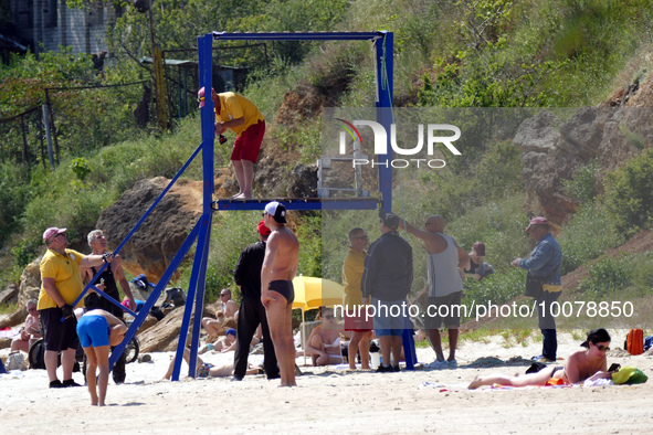 ODESA, UKRAINE - MAY 21, 2023 - Rescuers set up their towers on the ''Dog Beach'', Odesa, southern Ukraine. NO USE RUSSIA. NO USE BELARUS.
