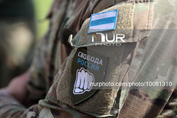 NORTHERN UKRAINE - MAY 24, 2023 -The patches with a white-blue-white flag and the logo of the Liberty of Russia Legion are seen during a bri...