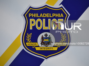 Philadelphia police logo on a police vehicle at the crime scene. One person shot several times and pronounced dead in Philadelphia, Pennsylv...