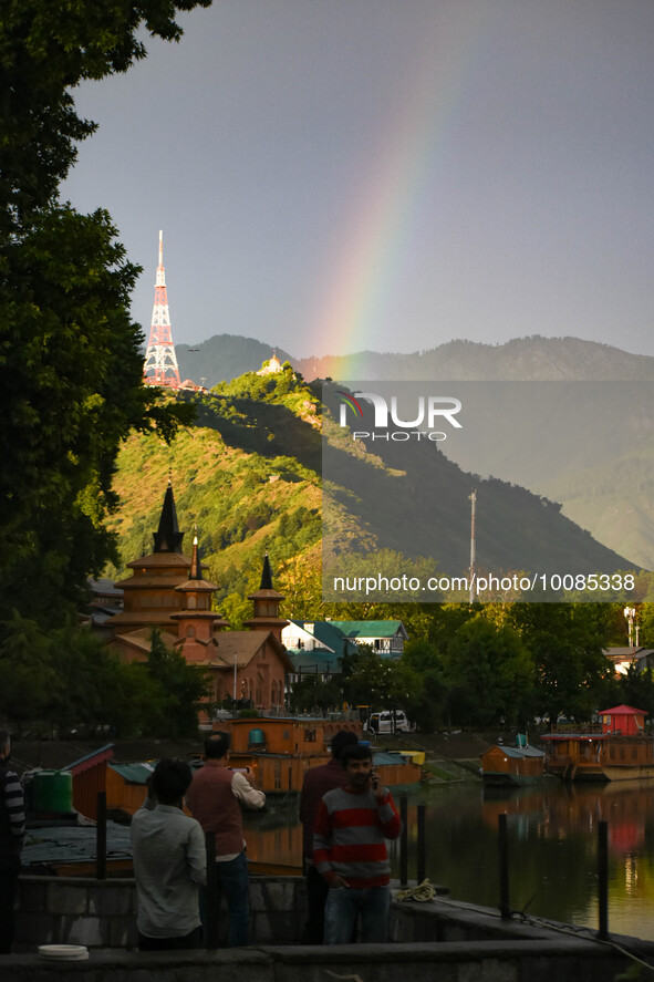 People click pictures of Rainbow after heavy rainfall in Srinagar, Indian Administered Kashmir on 25 May 2023. Rainfall will continue in the...