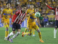 May 25, 2023, Monterrey, Mexico: Sebastian Cordova of Tigres of UANL  and Alan Mozo of Chivas fight the ball during the Closing Tournament F...