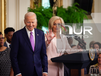 Head Coach of the Louisiana State University Women’s basketball team shares a laugh with President Joe Biden as she begins her remarks.  Pre...