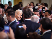 President Joe Biden moves through a sea of people at the conclusion of a ceremony celebrating the Louisiana State University Women’s basketb...