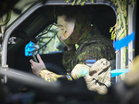An Estonian soldier is seen applying camouflage makeup in Tapa, Estonia on 20 May, 2023. Estonia is hosting the Spring Storm NATO exercises...