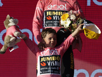 Primoz Roglic of Slovenia and Team Jumbo-Visma - Pink Leader Jersey with his son Levom celebrate at podium as overall winner during the 106t...