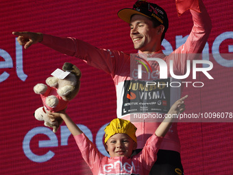 Primoz Roglic of Slovenia and Team Jumbo-Visma - Pink Leader Jersey with his son Levom celebrate at podium as overall winner during the 106t...