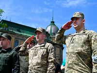 LVIV, UKRAINE - MAY 28, 2023 - Servicemen salute during the celebration of the Day of the Heroes at the monument to Ukrainian poet and artis...