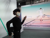BEIJING, CHINA - MAY 29, 2023 - A staff member demonstrates a ''motion capture system'' at the interactive exhibition of 2023 China Science...