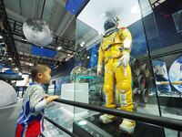BEIJING, CHINA - MAY 29, 2023 - A child visits a space suit at an interactive exhibition at the 2023 China Science Fiction Convention in Bei...