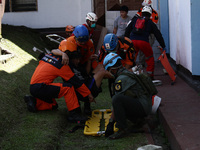 Joint Search And Resque officers (SAR) evacuate a victims during a simulation Earthquake Lembang Fault evacuation in Cisarua, Parongpong, We...