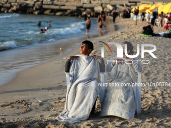 Palestinians enjoy the beach of the Mediterranean Sea on the coast of Gaza City, on May 31, 2023. 
 (