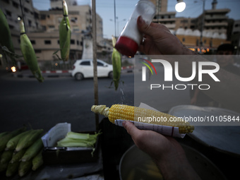 A Palestinian street vendor sells corn in Gaza City on May 31, 2023. 
 (