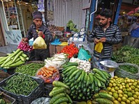  Vegetable sellers attend customers as it rains in Srinagar,Kashmir on June 01, 2023. Rains continued across Jammu and Kashmir leading to th...