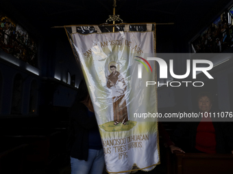 View of a banner and the representation of St. Francis of Assisi inside a parish church in the town of San Francisco Culhuacan in Mexico Cit...