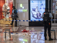 Police officers standing guard at the crime scene on June 2, 2023 in Hong Kong, China. Two women were stabbed to death by a man inside a sho...