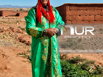 Berber woman dressed in fancy attire during a festival in Ait Benhaddou, Morocco, Africa. (