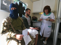 Fighters of Russian Volunteer Corps (RVC) take part in donating blood for the Armed Forces of Ukraine in Kyiv, Ukraine, on 3 June 2023, amid...