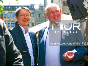 

Dr. Karl Lauterbach, the federal health minister, and Karl Josef Laumann, the minister of work and health of NRW, are seen greeting each o...