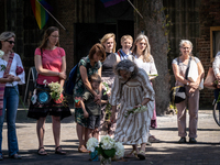 Attendees at the witch commemoration in Utrecht, Netherlands, on June 3, 2023. White flowers are today placed in places where witches used t...
