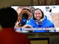 FUYANG, CHINA - JUNE 4, 2023 - People watch a live TV broadcast of the Shenzhou 15 Spacecraft Crew Returned to Earth in Fuyang City, Anhui P...