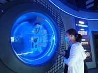 BEIJING, CHINA - JUNE 4, 2023 - Visitors look at the robot ''Moss'', a live-action prop from the movie ''The Wandering Earth 2'', at the 202...