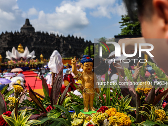 MAGELANG, CENTRAL JAVA, INDONESIA - JUNE 4: Buddhist devotees bathe Buddha statues as a part of celebrations for Vesak Day on June 4, 2023,...