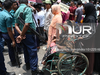 Disabled people protest demanding to raise their government allowance, in Dhaka, Bangladesh, on June 4, 2023.

 (
