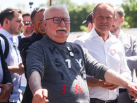 Opposition party leader Donald Tusk and Lech Walesa, the former President of Poland and the former leader of the Solidarity movement, attend...