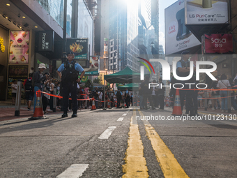 

Hong Kong, China, on June 4, 2023, Hong Kong police are cordoning off the street near the Causeway Bay MTR station. (