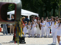 Ukrainian children perform during an event dedicated to the Day of remembrance of children who died as a result of the armed aggression of R...