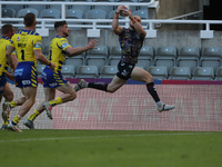 Hull FC's Adam Swift goes over for a try during the BetFred Super League match between Hull Football Club and Warrington Wolves at St. James...