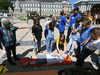 Ukrainian children take part at first aid training during an event dedicated to the Day of remembrance of children who died as a result of t...