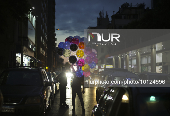 A man sells colored balloons on a street in central Beirut. Lebanon, Sunday, June 4th, 2023. The World Bank will dispatch $300 million in ad...